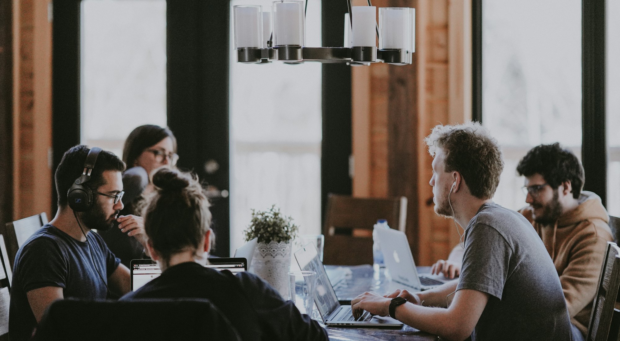 The Logic League team in conversation around a table